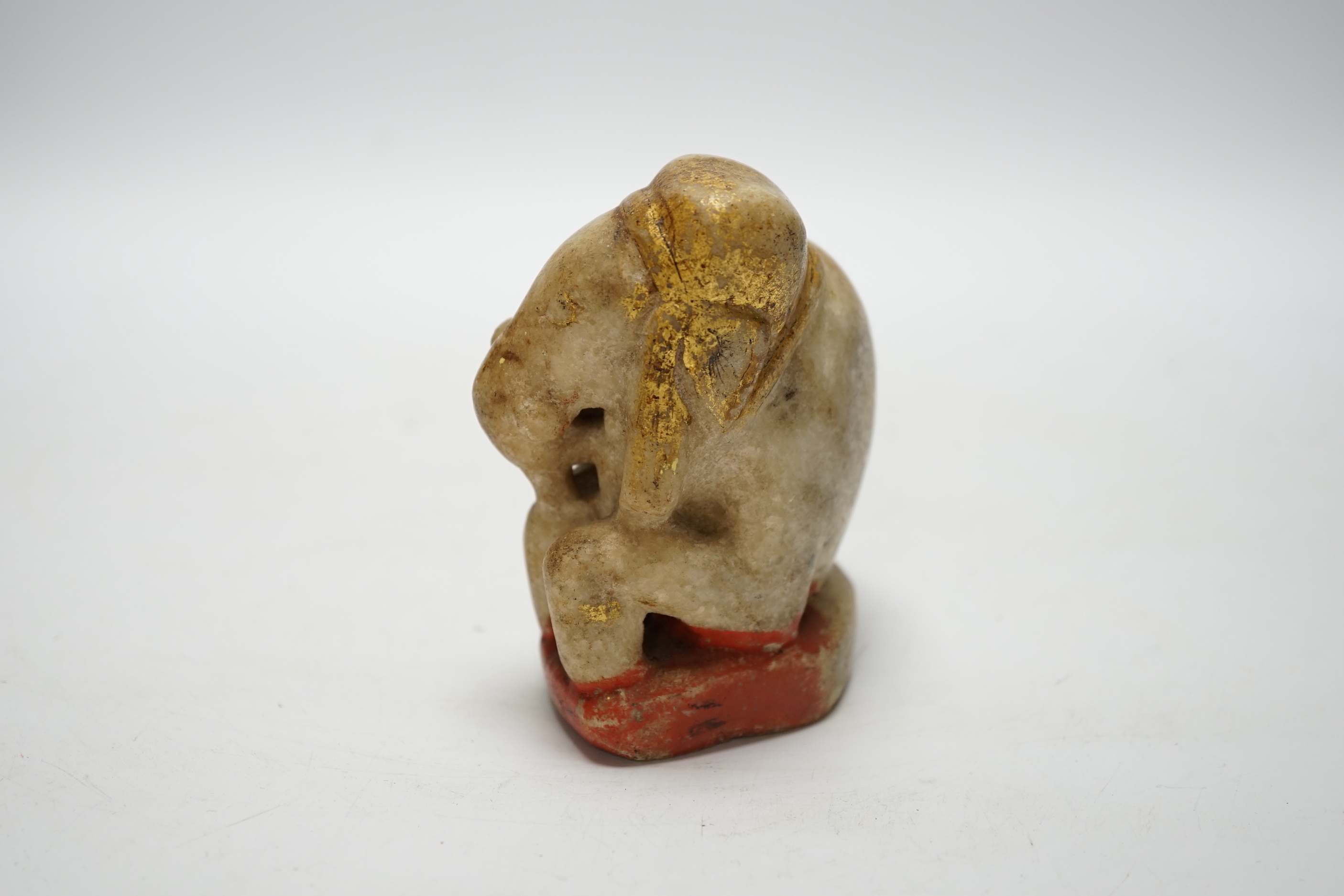 An Indian carved and painted alabaster model of an elephant, 10cm tall